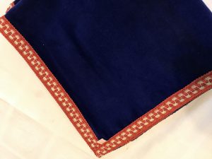 Royal blue velvet with orange check trimming (42"/1.07m sq) £60
