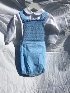 Blue dungarees and white shirt
